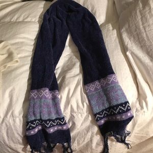Blue knit scarf with tasseled ends